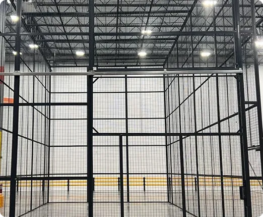 Reinforced DEA-compliant wire cage construction showing steel walls, floor, and ceiling framework.