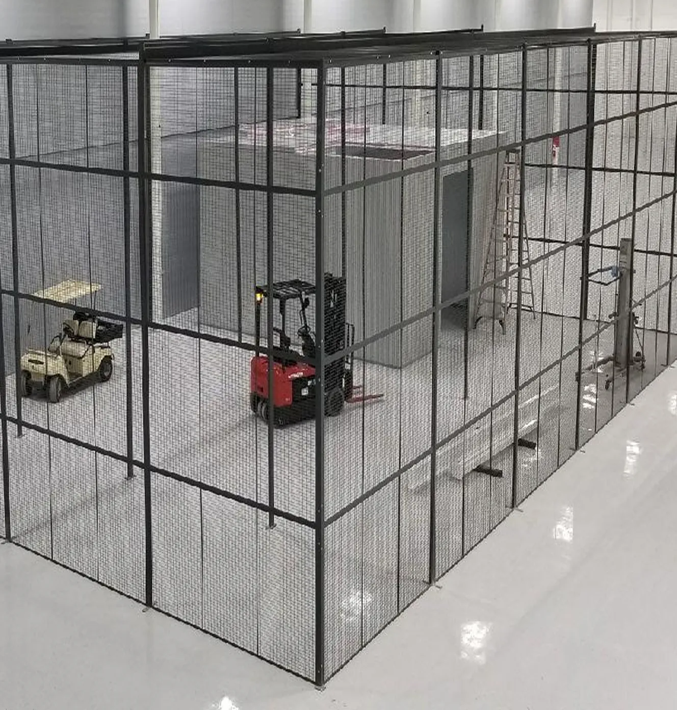 DEA-compliant wire cage structure built with heavy-duty steel posts and mesh panels.
